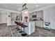Modern kitchen featuring a central island, stylish barstools, and gray cabinetry at 302 Willow Pointe Cir, Summerville, SC 29486