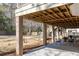 Spacious covered patio area with chairs and columns, providing a comfortable outdoor retreat with backyard views at 3021 Rushland Mews, Johns Island, SC 29455