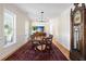 Bright dining room featuring hardwood floors, a large rug, and modern lighting at 3021 Rushland Mews, Johns Island, SC 29455