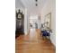 Inviting entryway with hardwood floors, elegant furnishings, and view into the adjacent living spaces at 3021 Rushland Mews, Johns Island, SC 29455