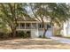 Charming two-story home featuring a welcoming staircase, covered porch, and manicured landscaping at 3021 Rushland Mews, Johns Island, SC 29455