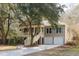 Charming two-story home with a welcoming front porch, two-car garage, and a well-manicured lawn at 3021 Rushland Mews, Johns Island, SC 29455