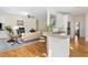 Open concept kitchen and living room area with hardwood floors and natural lighting at 3021 Rushland Mews, Johns Island, SC 29455