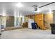 Unfinished basement featuring concrete block walls, a concrete floor, a refrigerator, and wooden supports at 305 Lanyard St, Johns Island, SC 29455
