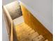 Wooden stairs leading to an unfinished basement with concrete block and plywood walls at 305 Lanyard St, Johns Island, SC 29455
