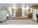 Spacious unfinished basement featuring concrete walls, a refrigerator, and wooden framing at 305 Lanyard St, Johns Island, SC 29455