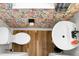 A bird's eye view of a stylish powder room with floral wallpaper and wood floors at 305 Lanyard St, Johns Island, SC 29455