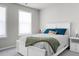 Bedroom with large window, white bed, and nightstand at 305 Lanyard St, Johns Island, SC 29455