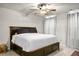 Relaxing bedroom featuring a ceiling fan, neutral colors, and a large bed with storage underneath at 305 Lanyard St, Johns Island, SC 29455