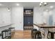 Open-concept entryway features coat rack, storage bins, and light wood-style flooring at 305 Lanyard St, Johns Island, SC 29455
