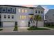 Charming townhome featuring a two-car garage, covered entry and manicured lawn at 305 Lanyard St, Johns Island, SC 29455