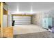 Spacious two car garage with white door and walls, and concrete flooring at 305 Lanyard St, Johns Island, SC 29455