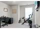 Bright home office with a desk, chair, and an exercise bike at 305 Lanyard St, Johns Island, SC 29455