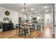 Well-lit kitchen features stainless steel appliances, countertops, island, and modern finishes at 305 Lanyard St, Johns Island, SC 29455