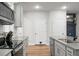 Modern kitchen with stainless steel appliances and eat-in island area at 305 Lanyard St, Johns Island, SC 29455