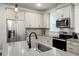 Bright kitchen featuring stainless steel appliances and island with sink at 305 Lanyard St, Johns Island, SC 29455