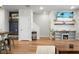 Open-concept living room featuring modern decor, a coastal themed accent wall, and wood floors at 305 Lanyard St, Johns Island, SC 29455
