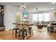 Bright living room featuring a large sectional couch, area rug, and natural light at 305 Lanyard St, Johns Island, SC 29455