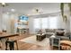 Inviting living room featuring a large sectional sofa, wood floors, and beach-themed decor at 305 Lanyard St, Johns Island, SC 29455
