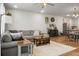 Open-concept living space with neutral decor, wood floors, and comfortable seating at 305 Lanyard St, Johns Island, SC 29455