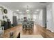 Bright open-concept space featuring a kitchen with island, dining area, and living room at 305 Lanyard St, Johns Island, SC 29455