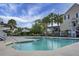 Inviting community pool area with ample seating and palm trees, perfect for relaxation at 305 Lanyard St, Johns Island, SC 29455