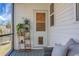 Cozy screened porch with outdoor furniture and a view of lush landscaping at 305 Lanyard St, Johns Island, SC 29455