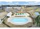 Aerial view showcasing community pool, playground, and nearby residences at 314 Foxbank Plantation Blvd, Moncks Corner, SC 29461