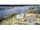 Aerial view of the community pool, playground and lake, showcasing community ammenities and natural surroundings at 314 Foxbank Plantation Blvd, Moncks Corner, SC 29461