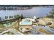 Aerial view of community pool, playground, community buildings, and lake at 314 Foxbank Plantation Blvd, Moncks Corner, SC 29461