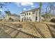 Expansive backyard featuring a well-maintained lawn, a patio area, and mature trees offering natural shade at 314 Foxbank Plantation Blvd, Moncks Corner, SC 29461