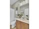 Well-lit bathroom featuring a single sink vanity with decorative accents and a shower with a white curtain at 314 Foxbank Plantation Blvd, Moncks Corner, SC 29461
