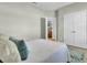 Calm bedroom with a comfortable bed, featuring an open ensuite bathroom and closet area at 314 Foxbank Plantation Blvd, Moncks Corner, SC 29461