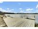 Long wooden community pier extending over the lake, offering scenic views and relaxing waterside recreation at 314 Foxbank Plantation Blvd, Moncks Corner, SC 29461