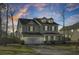 Charming two-story home with a covered front porch and attached two-car garage at 314 Foxbank Plantation Blvd, Moncks Corner, SC 29461