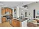 Open-concept kitchen with large island, stainless steel appliances, and view of the living area at 314 Foxbank Plantation Blvd, Moncks Corner, SC 29461