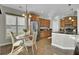Sunlit kitchen features stainless steel appliances, granite countertops, and cozy breakfast nook at 314 Foxbank Plantation Blvd, Moncks Corner, SC 29461