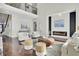 Spacious living area with a fireplace, hardwood floors, and a second-floor balcony view at 314 Foxbank Plantation Blvd, Moncks Corner, SC 29461