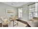 Bright home office with neutral walls, hardwood floors, and natural light from windows at 314 Foxbank Plantation Blvd, Moncks Corner, SC 29461