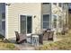 Outdoor patio area with sliding glass doors, dark wicker seating and a rug at 314 Foxbank Plantation Blvd, Moncks Corner, SC 29461