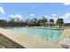 Large community pool with lane markers, ladder, and lounge chairs offering a refreshing and relaxing experience at 314 Foxbank Plantation Blvd, Moncks Corner, SC 29461