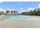 Zero entry community pool featuring a beach entry, pergola, and a fenced playground for Gathering fun at 314 Foxbank Plantation Blvd, Moncks Corner, SC 29461