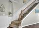 Elegant staircase featuring hardwood steps and a decorative runner at 314 Foxbank Plantation Blvd, Moncks Corner, SC 29461