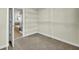 Walk-in closet offering ample storage with white wire shelving and easy access to the bathroom at 314 Foxbank Plantation Blvd, Moncks Corner, SC 29461