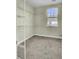 Walk-in closet featuring wire shelving and a window providing natural light for easy organization at 314 Foxbank Plantation Blvd, Moncks Corner, SC 29461