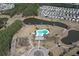 Aerial view of community featuring pool, playground, walking path, lake, and homes at 317 Cantley Ct, Summerville, SC 29486