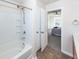 Well-lit bathroom features a tub/shower and a view into the bedroom at 317 Cantley Ct, Summerville, SC 29486