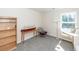 Bright bedroom with carpet, featuring a bookshelf, table, and ample natural light at 317 Cantley Ct, Summerville, SC 29486