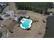 Aerial view of the community pool, playground, and amenities surrounded by lush landscaping at 317 Cantley Ct, Summerville, SC 29486