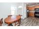 Charming dining area with a view of the kitchen, featuring a wood table and chairs at 317 Cantley Ct, Summerville, SC 29486